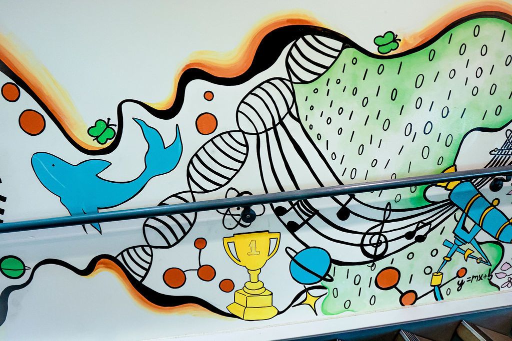 Detail: a music staff, a trophy, a planet and a DNA helix